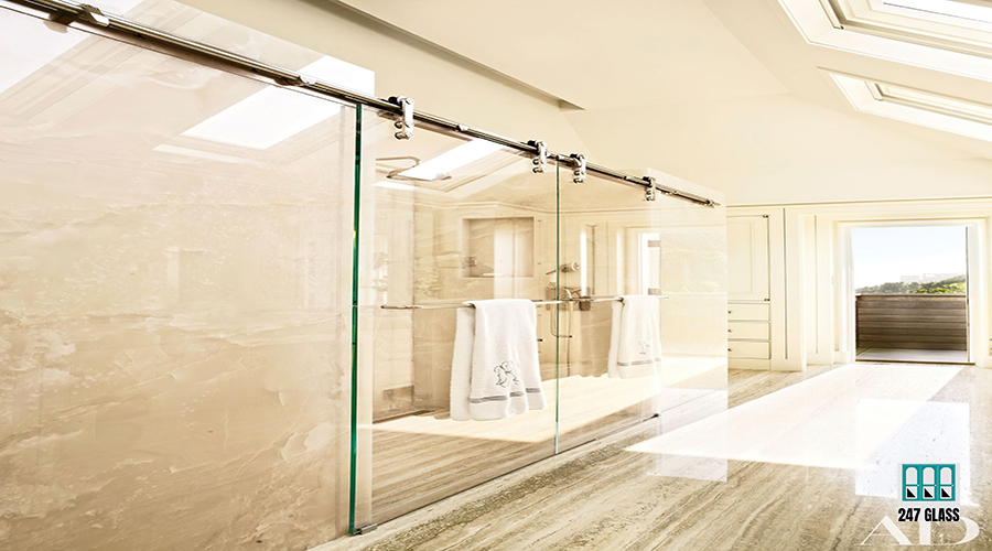 bathroom-with-glass-shower-door-towel-rack-with-towels-hanging-from-it bathroom-with-glass-shower-door-towel-rack-with-towels-hanging-from-it