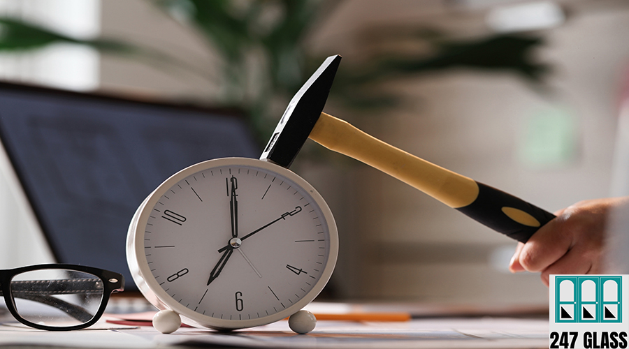 Hating Monday mornings! Close up of unrecognizable person using hammer and hitting alarm clock.
