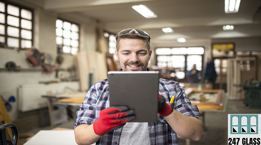 Creative worker carpenter looking for new ideas in workshop. Creative worker carpenter looking for new ideas in workshop.