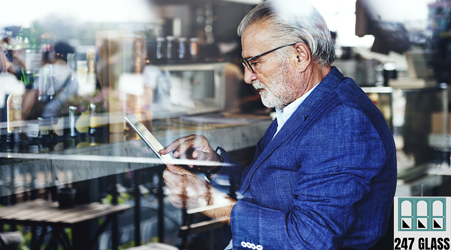 Elderly man is using digital tablet Elderly man is using digital tablet