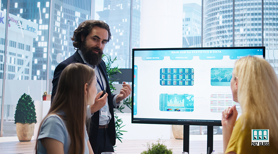 Financial advisor presents detailed stock market analysis to clients Financial advisor presents detailed stock market analysis to clients on big screen, helping them make informed investment decisions. Broker in office providing family with financial analysis, camera A