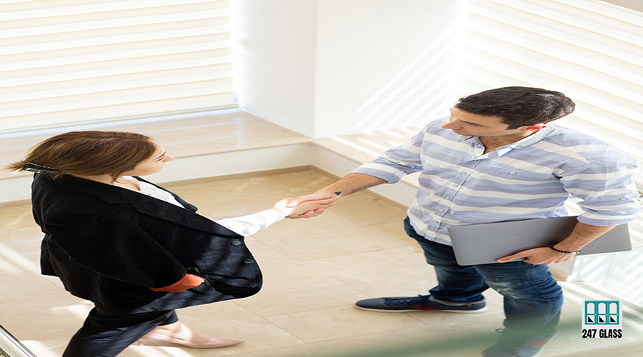 a front view young businessman in striped shirt along with young Glass Door Service for Homes and Offices