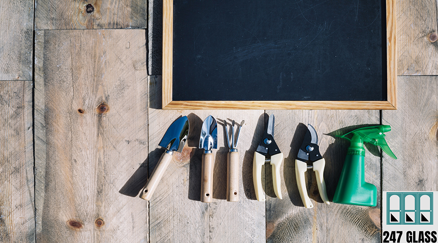 gardening-tools-near-blackboard gardening-tools-near-blackboard