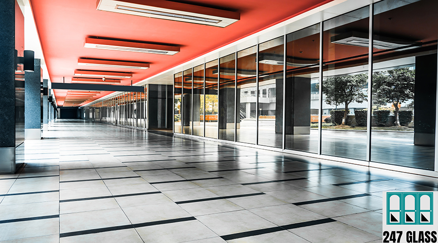empty long corridor in the modern office building. Window Installation for Retail Shop