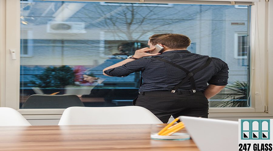 man-talking-phone-office Glass Repair Services