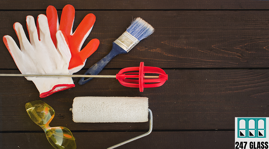 Set of painter's tools on wooden background. Painting tools for home. Window Installation for Retail Shop