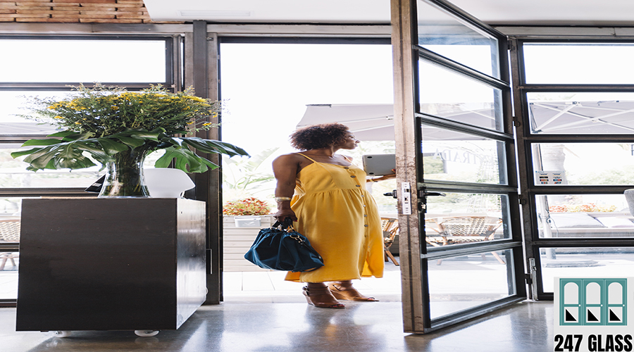 stylish-young-woman-standing-near-restaurant-entrance Glass Door Service for Homes and Offices