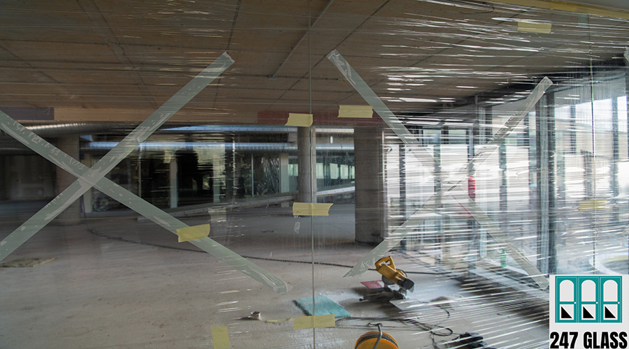 A captivating view of a modern business building under construction, showcasing its raw industrial interior with exposed steel beams and concrete walls bathed in the warm, golden hues of a sunset A captivating view of a modern business building under construction, showcasing its raw industrial interior with exposed steel beams and concrete walls bathed in the warm, golden hues of a sunset.