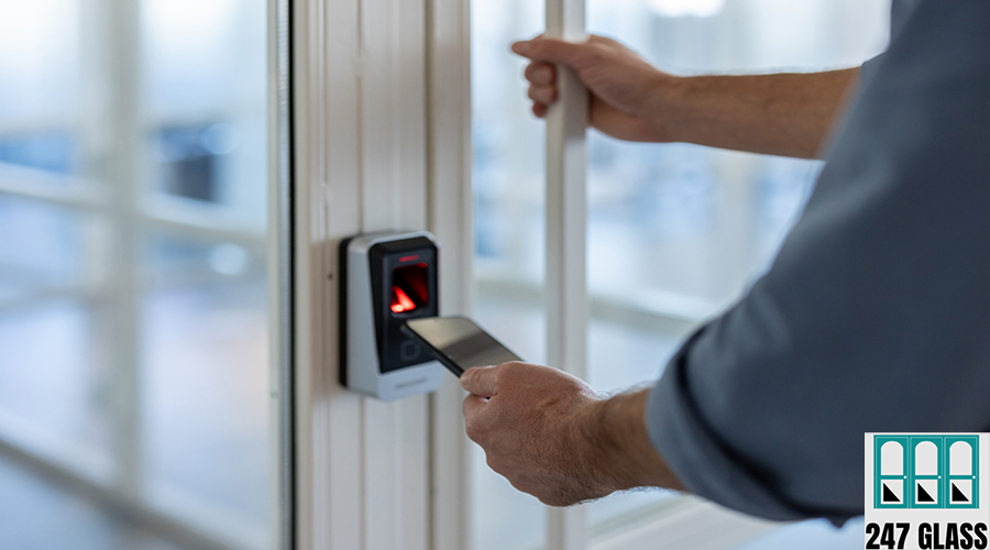 A person is using their smartphone to unlock the door with a security system. commercial door service