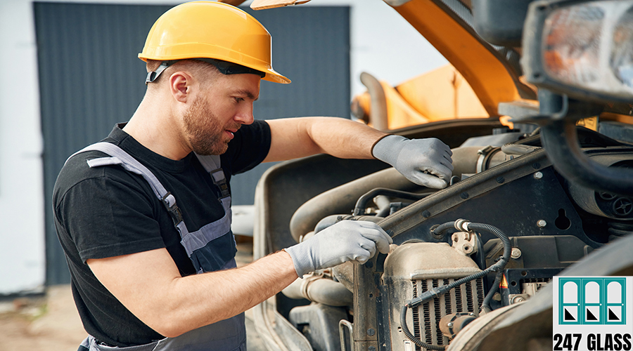 Doing maintenance. Man is with tractor. Agricultural worker Doing maintenance. Man is with tractor. Agricultural worker.