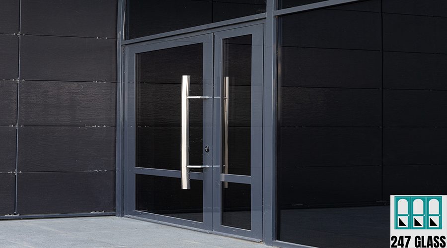 Side-view of glass door - entry to modern office building